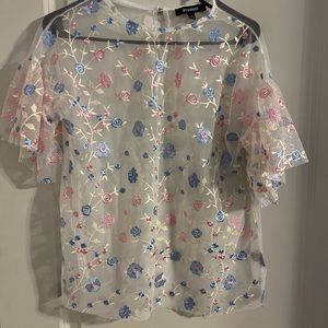 White,floral, sheer shirt. Gently used.